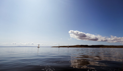 Portrait of sailing boats on open sea