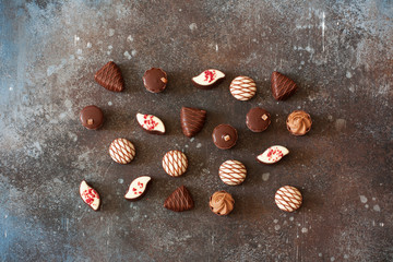 Chocolates on stone background