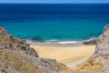 Secluded beach in the Papagayo Coast in Lanzarote, Spain
