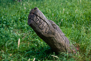 Real pagan altar in the forest with idols in summer light 