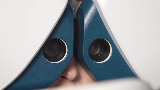 close up shot of the phoropter, this ophthalmic device pivots to measure the refractive error of the patient and determine the information for the prescription for glasses