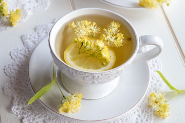 A cup of herbal tea with linden flowers