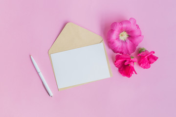 Mockup white greeting card and envelope with pink flowers