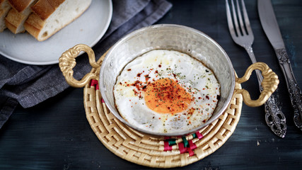 fried egg in the copper frying pan