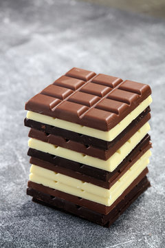 chocolate in diffrent color. milk, dark and white chocolate bars