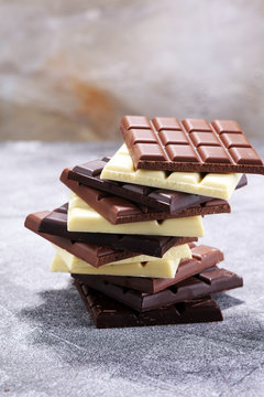 chocolate in diffrent color. milk, dark and white chocolate bars