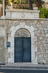 Fototapeta na wymiar Stone wall and steel door Dubrovnik, Croatia