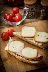 Sandwich with ham and smoked cheese.