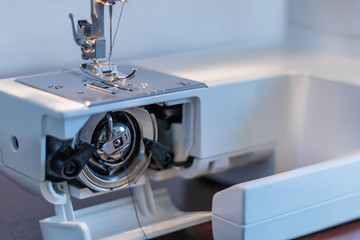 Fototapeta premium The working area of the sewing machine close-up
