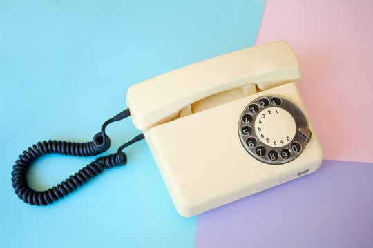 Vintage telephone with a colorful background
