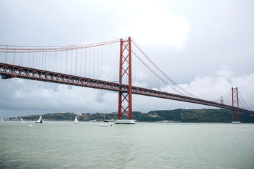 Fototapeta na wymiar Bridge called April 25 in Lisbon in Portugal against the sky