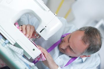 fashion designer using sewing machine