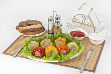 Bulgarian pepper stuffed with meat with herbs sauce and sour cream. A fine meal for lunch.