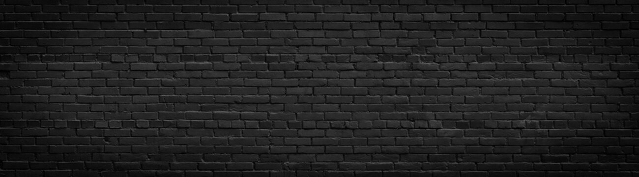 Old black brick wall panorama