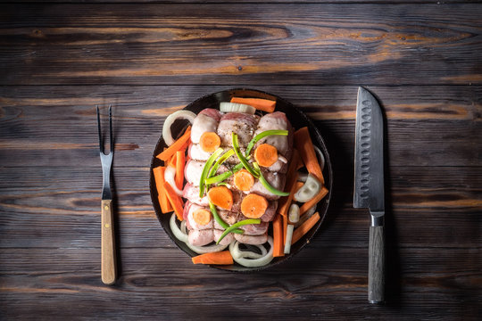 Raw pork chop marinated meat roll with assorted vegetables - Powered by Adobe