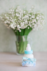 decorative baby bottle with milk are on the table. For a baby shower celebrate. for thematic birthday decor