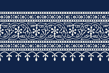 Woodblock printed indigo dye seamless ethnic floral geometric border. Traditional oriental ornament of India Kashmir, flowers wave and arcade motif, ecru on navy blue background. Textile design.
