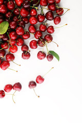 Cherry. Red fresh Cherries in bowl and a bunch of cherries on the table