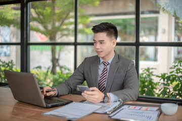 Business man wsitting at his desk in the office