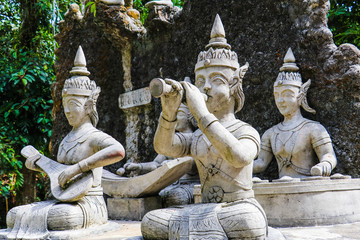 Ancient stone statues in Secret Buddhism Magic Garden, Koh Samui, Thailand. A place for relaxation and meditation.
