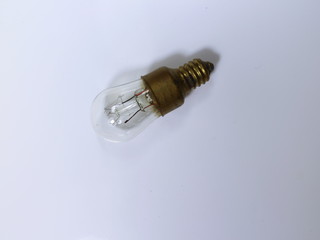 electric incandescent light on white table