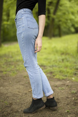 Woman buttocks in blue jeans