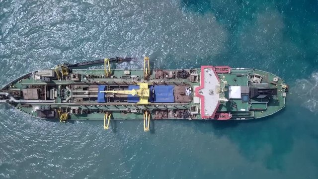 Suction-Dredger vessel at sea - Top down aerial footage