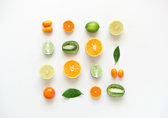 Fruit colorful background. Fresh fruits on white table background. Orange, tangerine, kiwi, lime, lemon. Flat lay, top view, copy space 