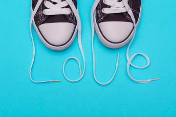 The inscription of love with laces of a sneaker.