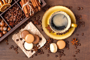 Cup of coffee with french macaroons cookies