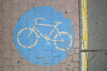 
Blue bicycle sign on the floor