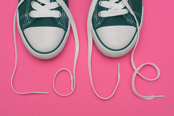 The inscription of love with laces of a sneaker.