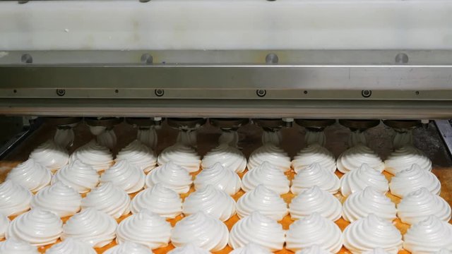 Confectionery factory, food industry production. Tray with marshmallow or zephyr made by automated machinery equipment.