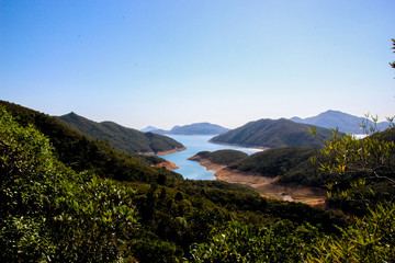 View of lake and green mountains in Hong Kong