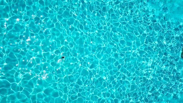 Topview from a drone over the surface of the pool