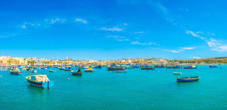Colorful fishing boats moor in Marsaxlokk, Malta