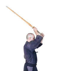 swordsman in attacking position with bamboo sword 'sinai'  for Japanese fencing Kendo training