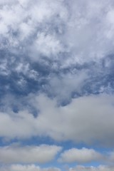 Fluffy white clouds in blue sky