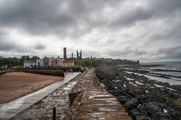 Fototapeta premium Beach, pier and sea at tide at St Andrew, Scotland