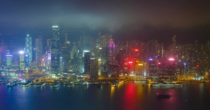 Aerial timelapse of illuminated Hong Kong skyline. Hong Kong, China