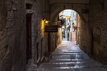 A picturesque alley in the old town of Vieste, a famous seaside town for summer holidays, Gargano, Apulia, italy