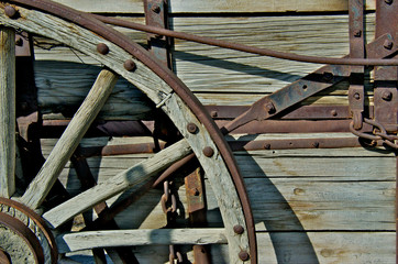 Cropped image of Wagon Wheel and break system on old haul wagon 