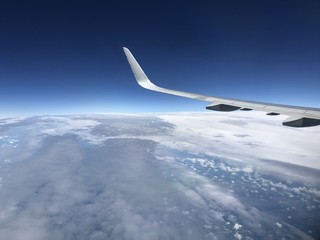 Fototapeta na wymiar Sky from airplane window 