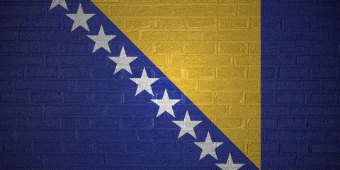 Flag of Bosnia and Herzegovina on brick wall background, 3d illustration