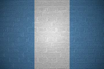 Flag of Guatemala on brick wall background, 3d illustration