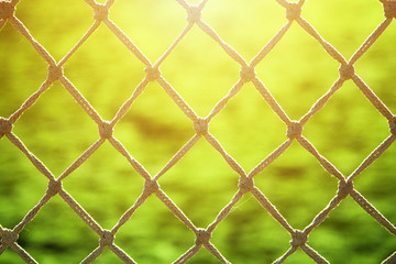 Naklejka premium Soccer net at sunset close-up