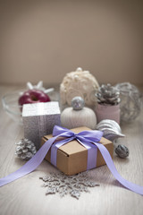 Christmas composition with gift box with satin ribbon bow materials for decorating Christmas toy bump.
