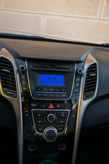 Functional control panel for a car with a lot of buttons.