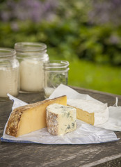 Three kinds of Cheese on Farm Table