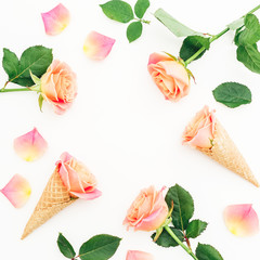 Floral frame with roses flowers, buds and waffle cones on white background. Flat lay, top view. Summer background
